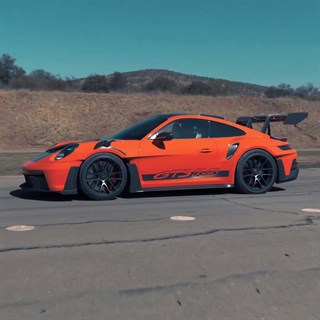 Minichamps Porsche 911 (992) GT3 RS 2023 - Orange w. Black Wheels 1:18 model car